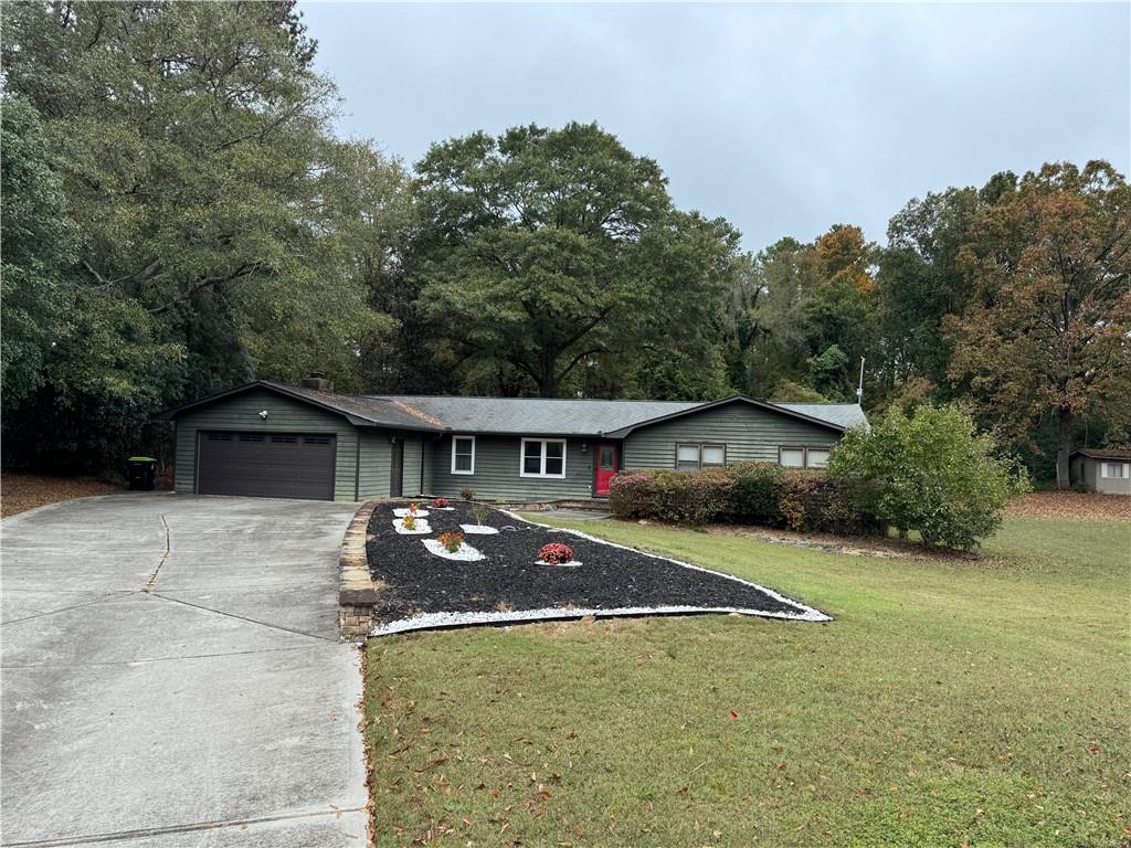 a front view of a house with yard