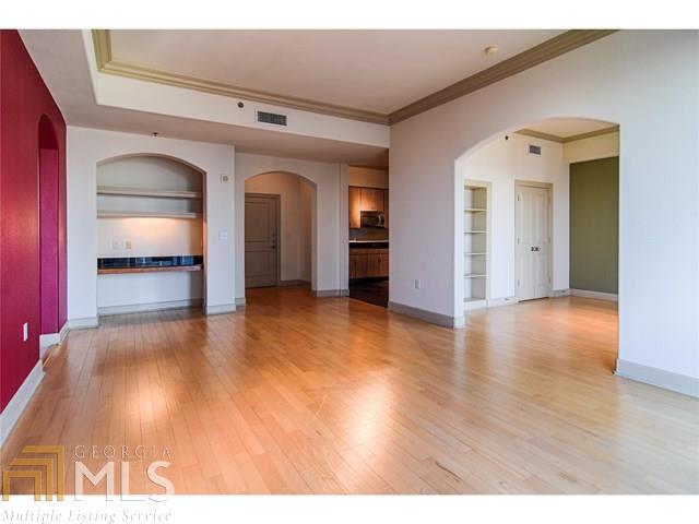 a view of a room with wooden floor