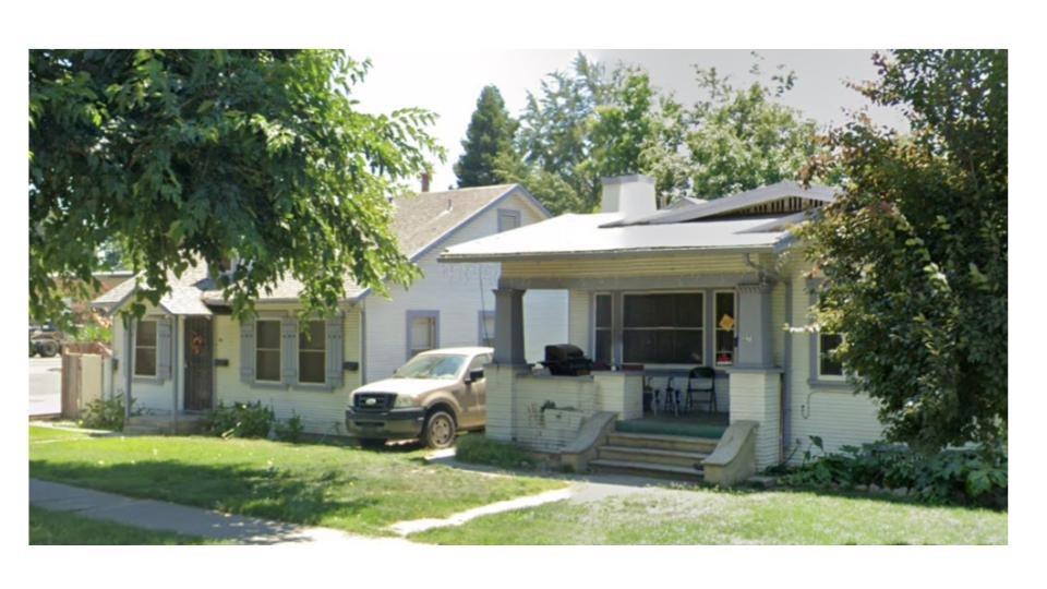 a view of a house with backyard sitting area and garden