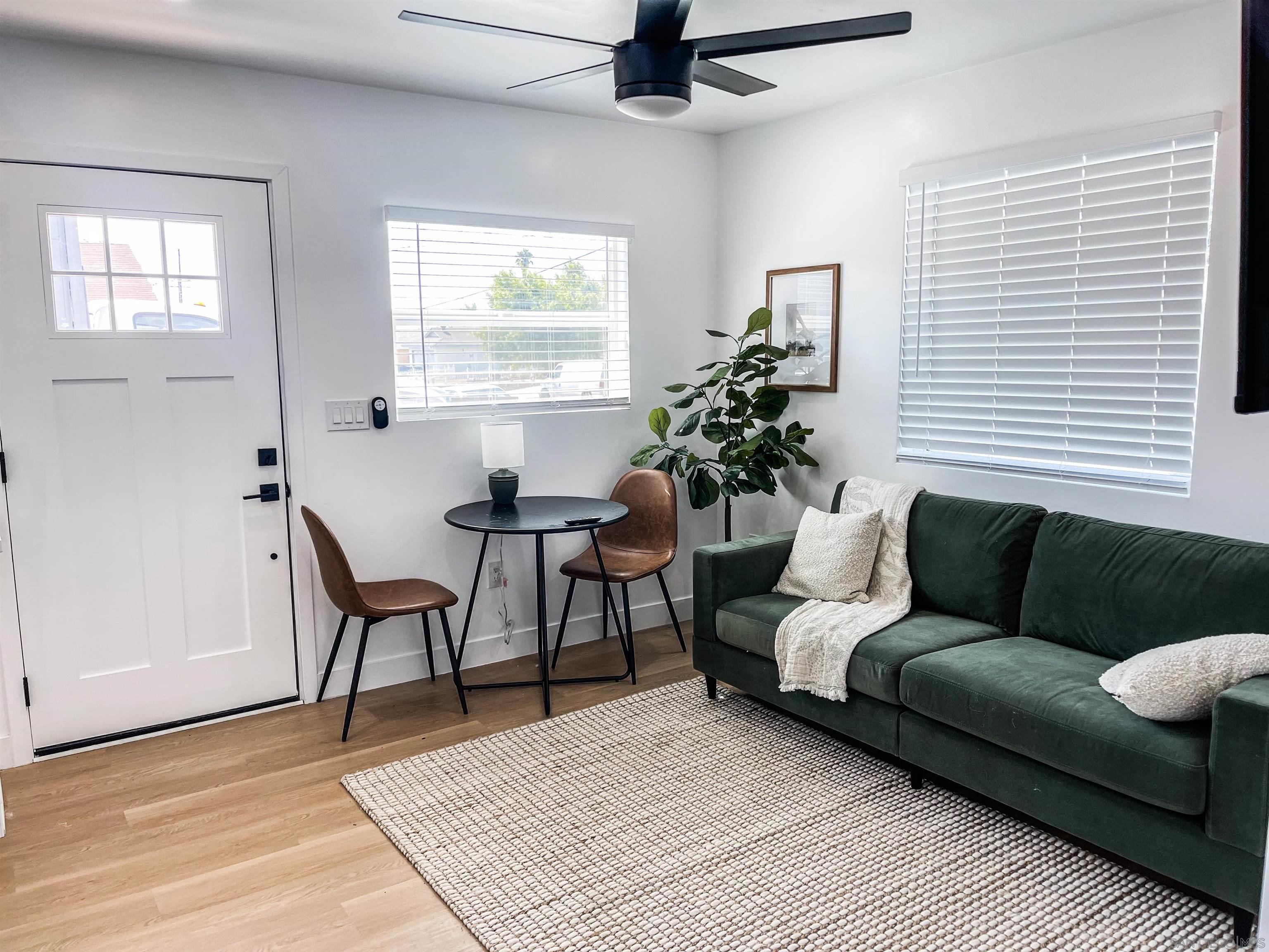 a living room with furniture and a window