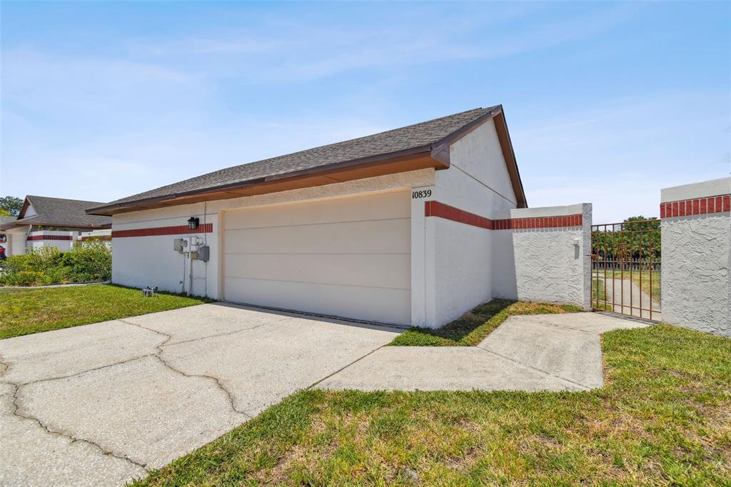 a backyard of a house with yard and garage