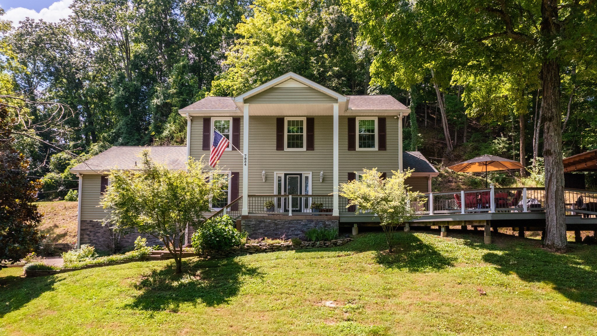 a front view of a house with swimming pool