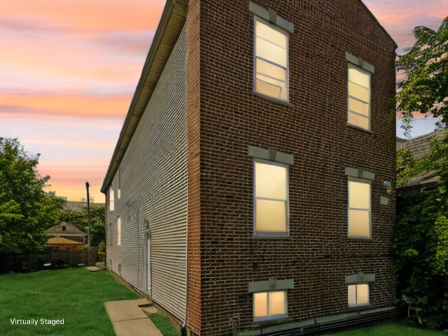 a brick house with a large windows