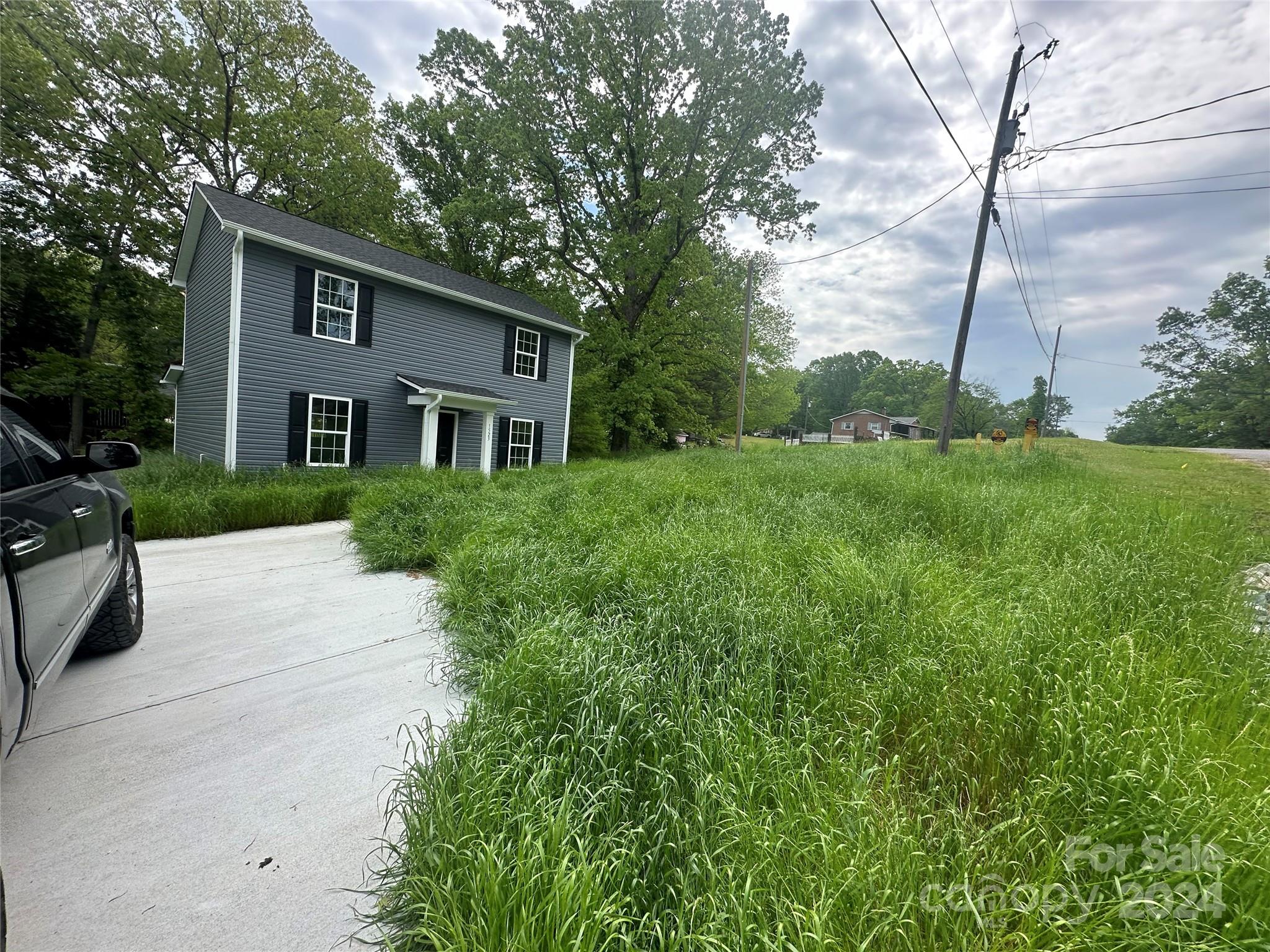 a front view of a house with a yard