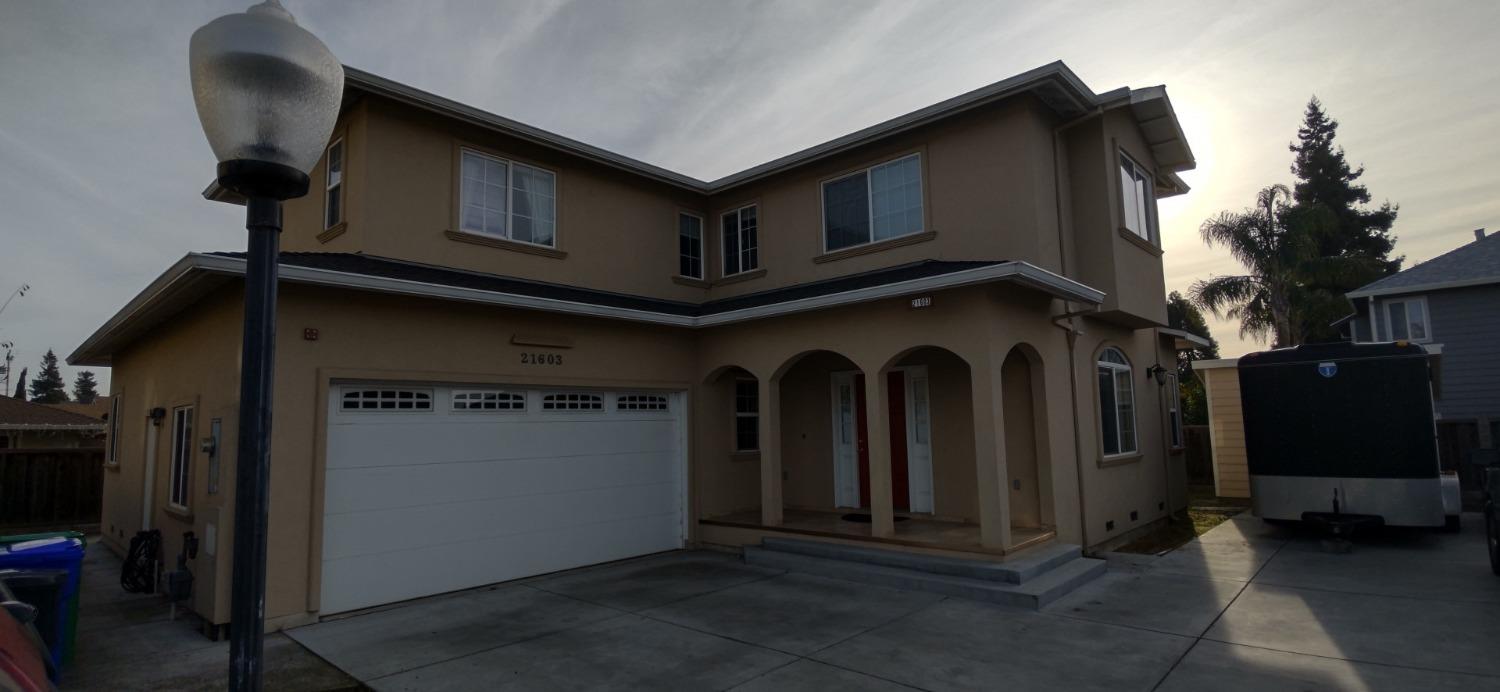 a front view of a house with garage