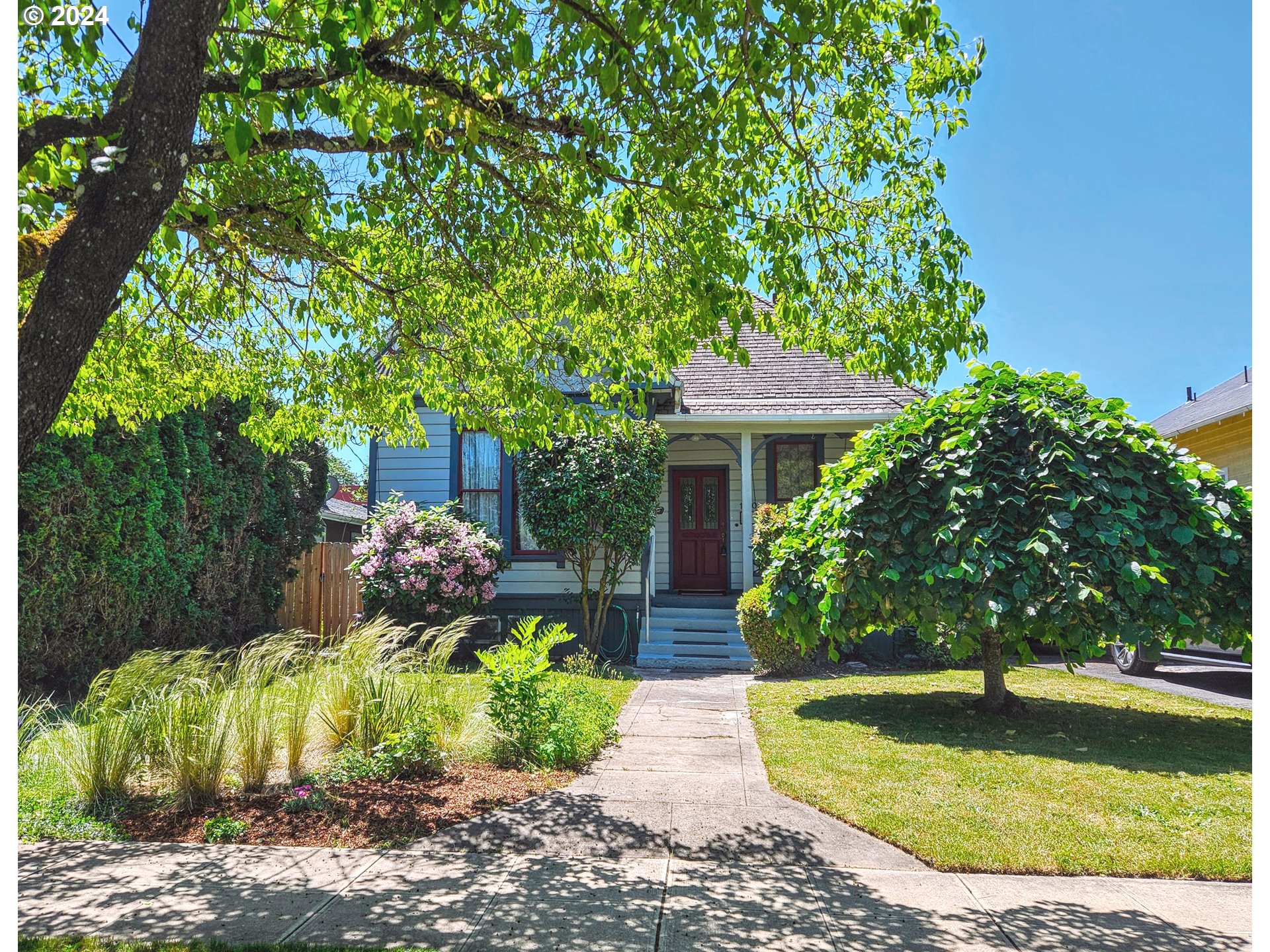 a front view of a house with a yard