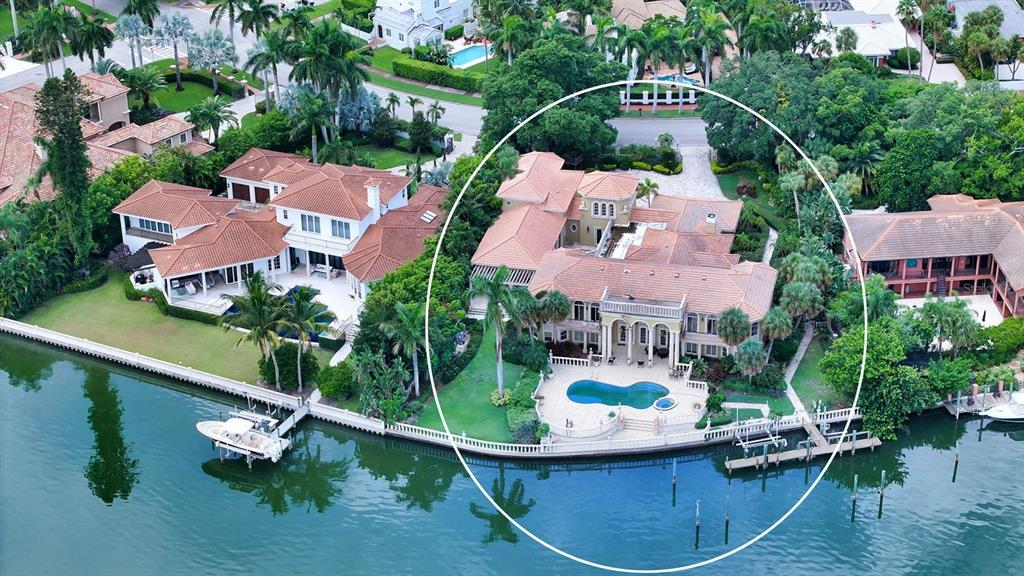 an aerial view of house with yard swimming pool and outdoor seating