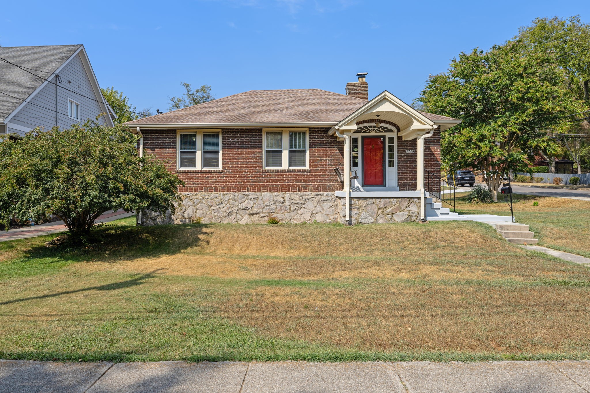 a front view of a house with a yard