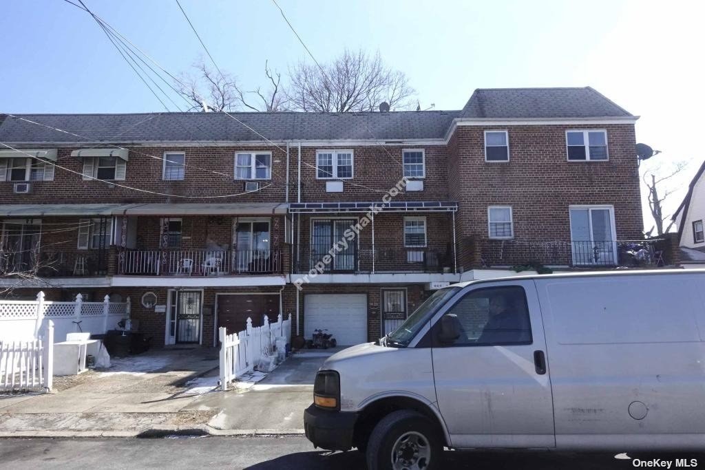 a front view of a house with parking space