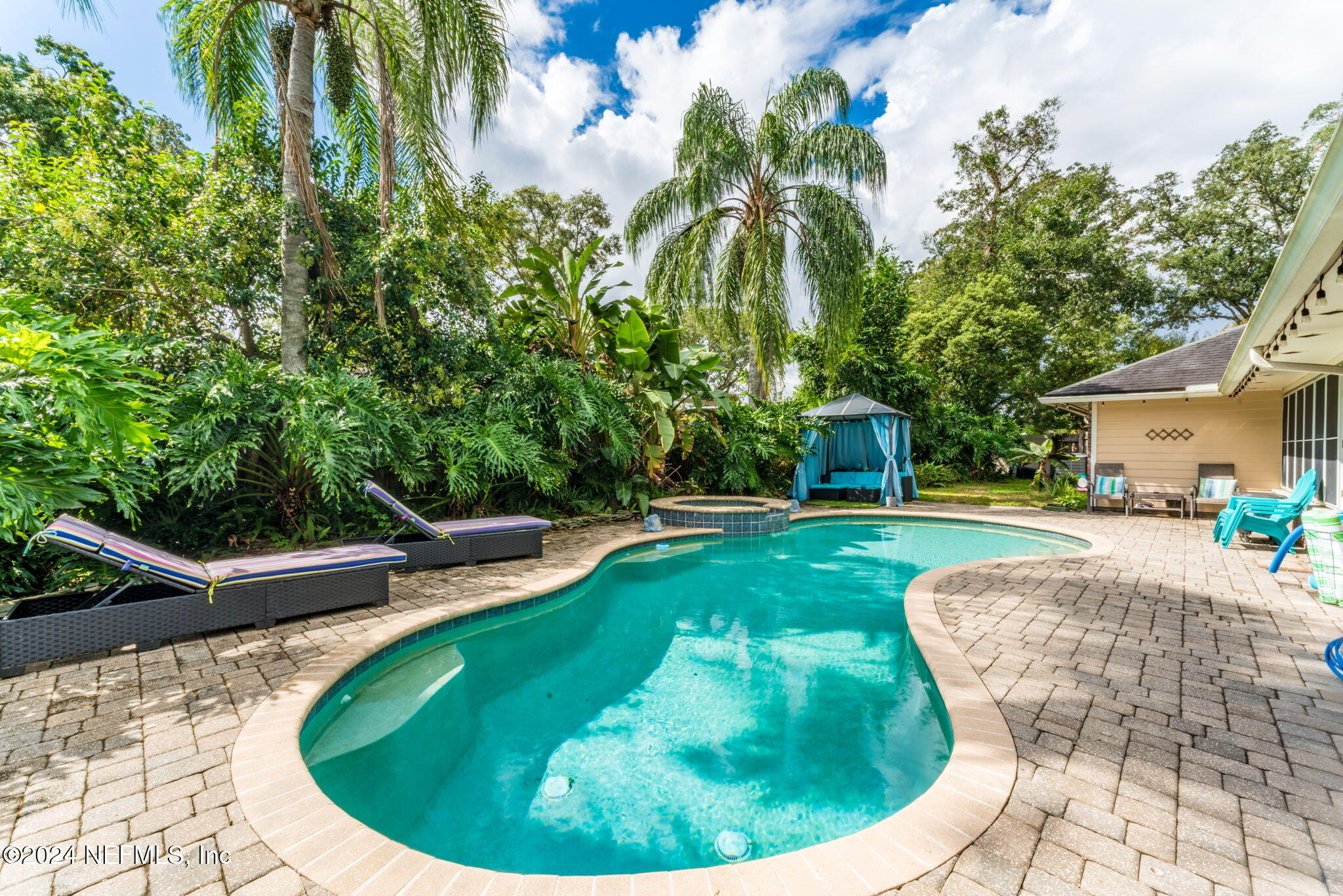 a view of a swimming pool with a sitting space