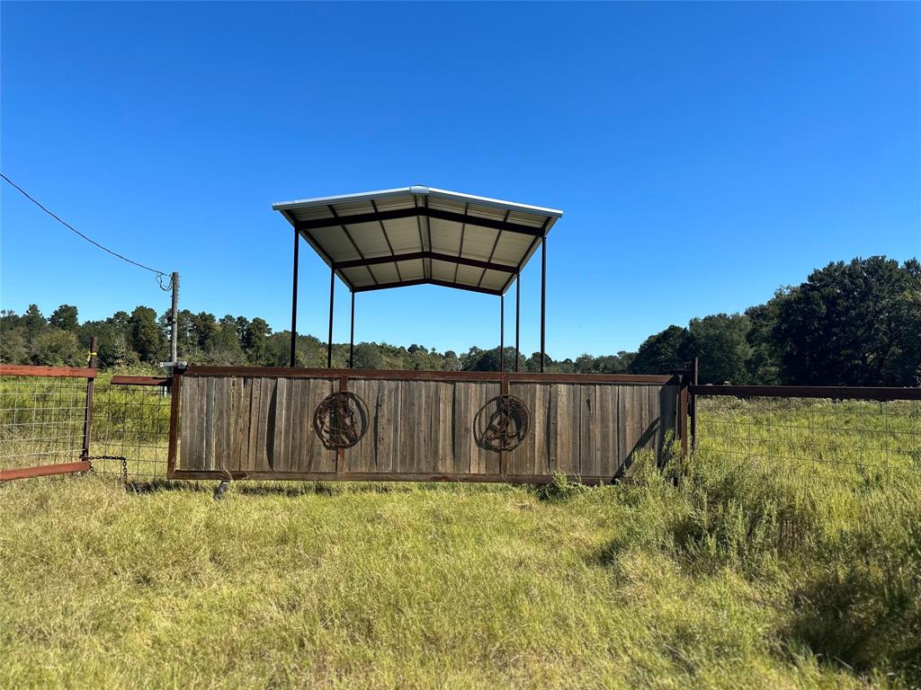 a view of a backyard with a wooden fence