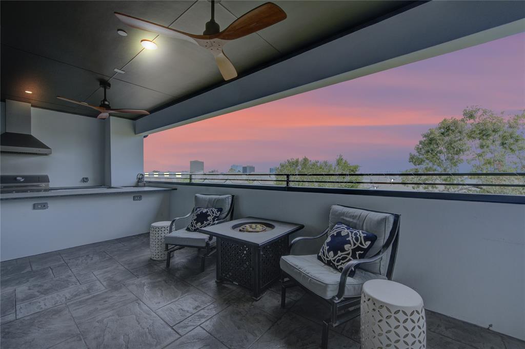 a view of a chairs and table in a balcony