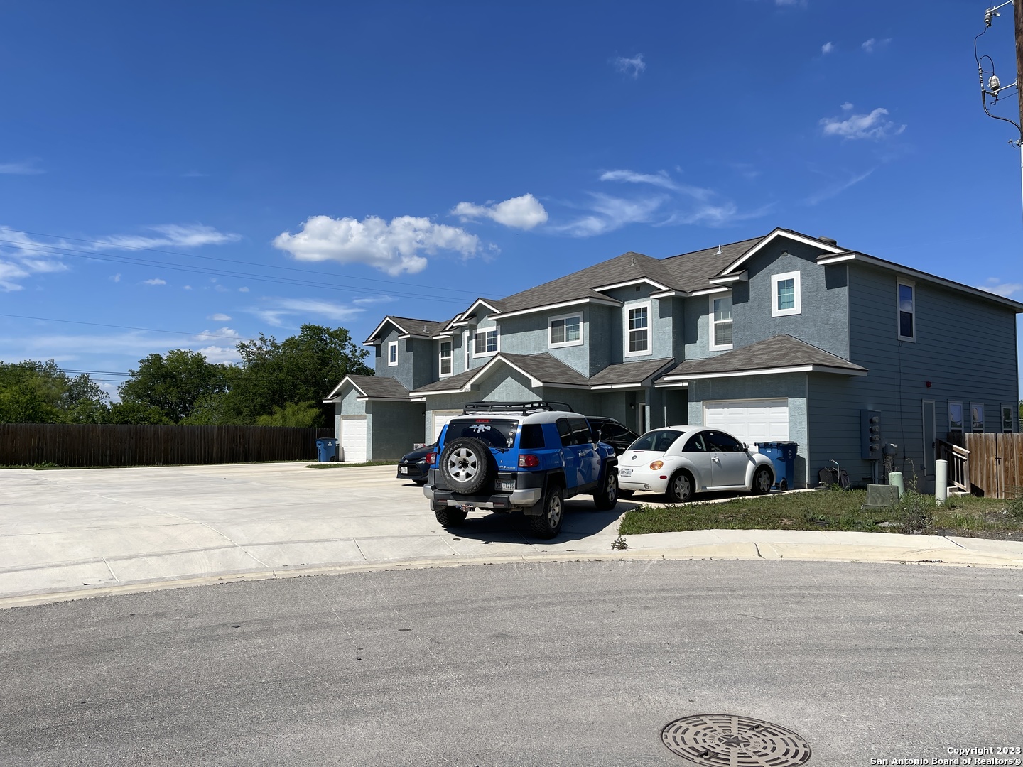 a view of a car parked in front of a house