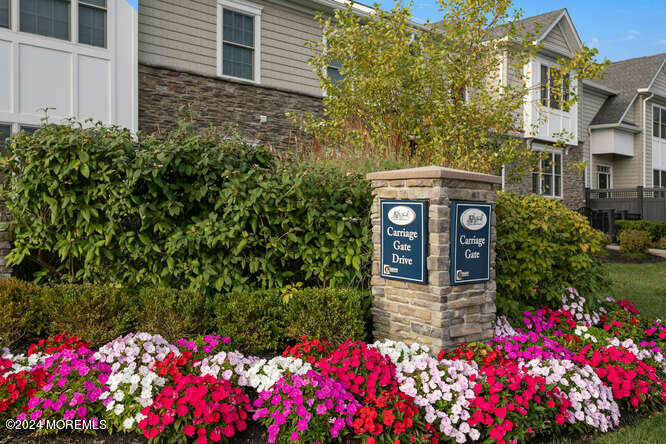 a view of a house with a flower garden