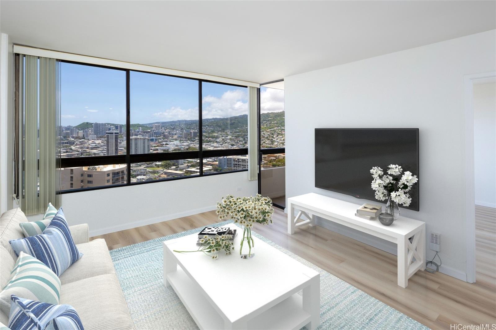 a living room with furniture and a large window