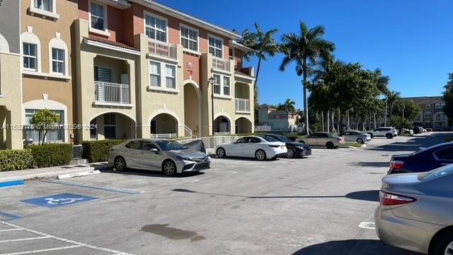 a view of a street with cars