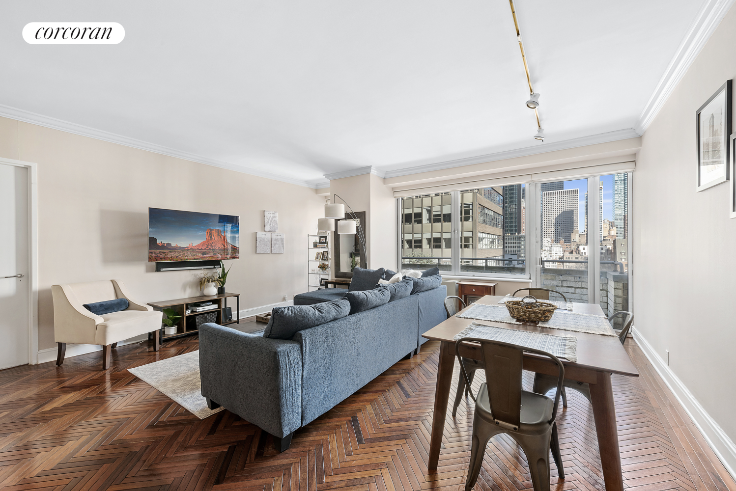 a living room with furniture and a flat screen tv