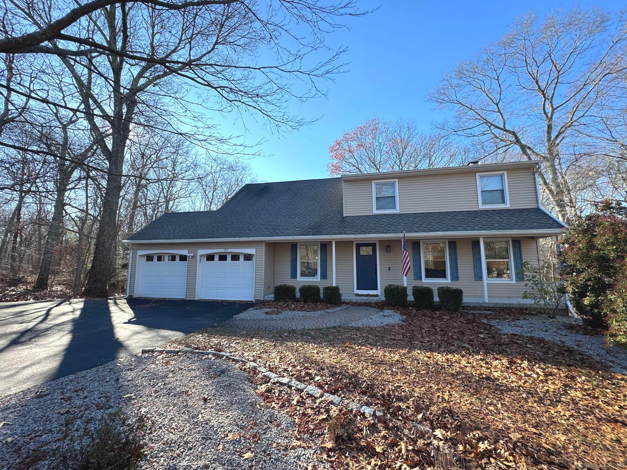 front view of a house with a yard