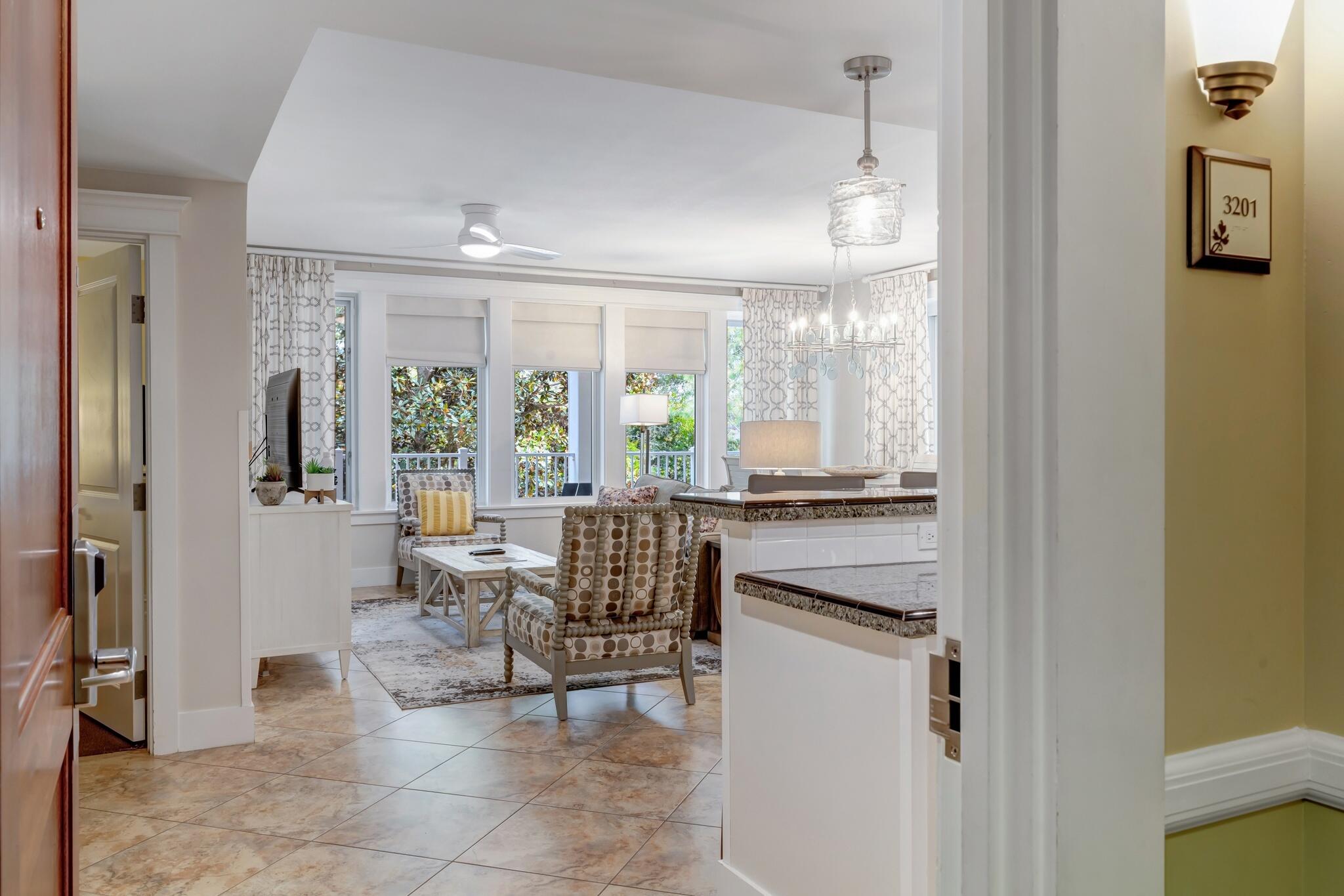 a dining room with stainless steel appliances a dining table and chairs