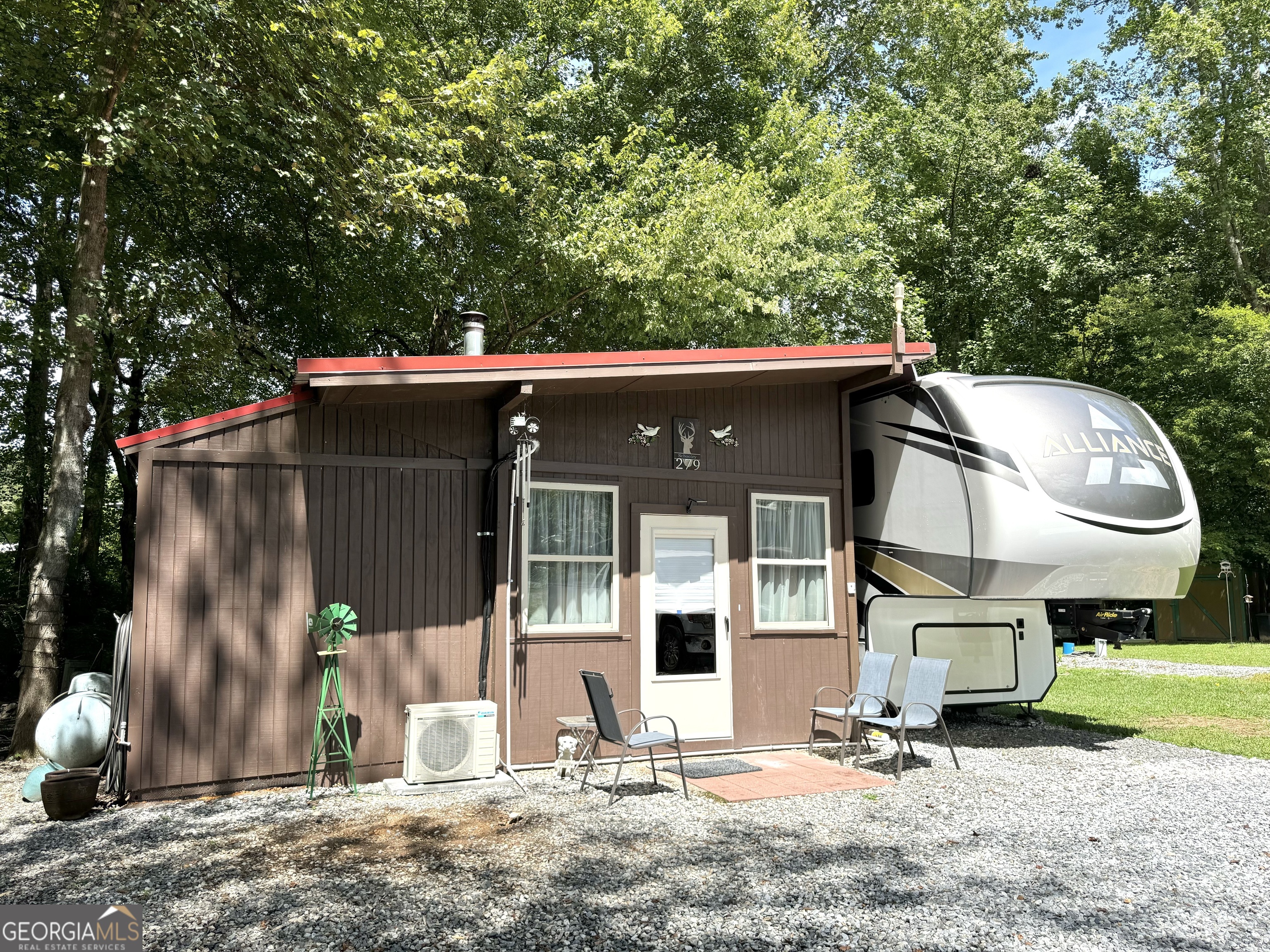 a view of a house with a backyard