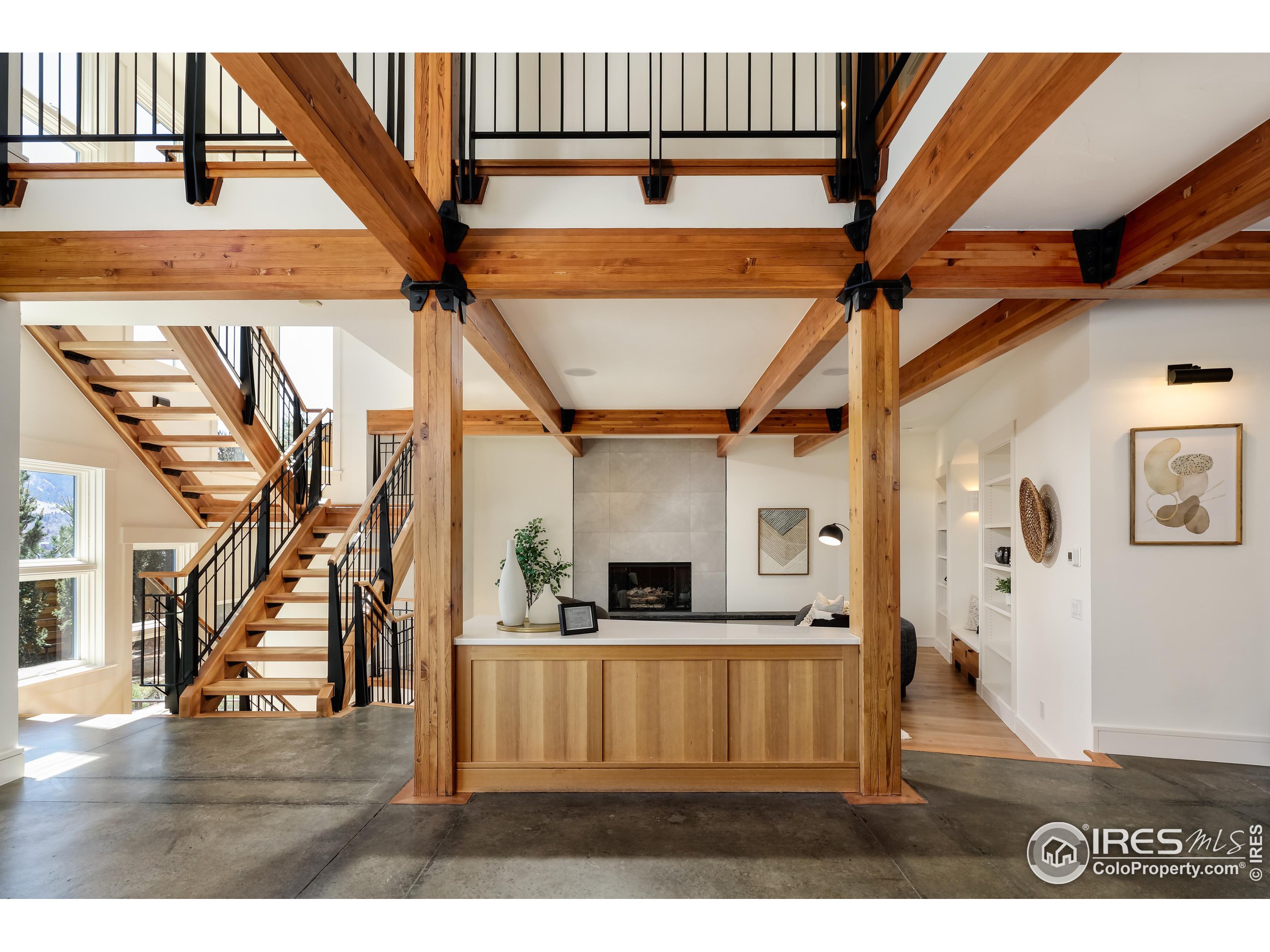 a view of living room kitchen with furniture and wooden floor