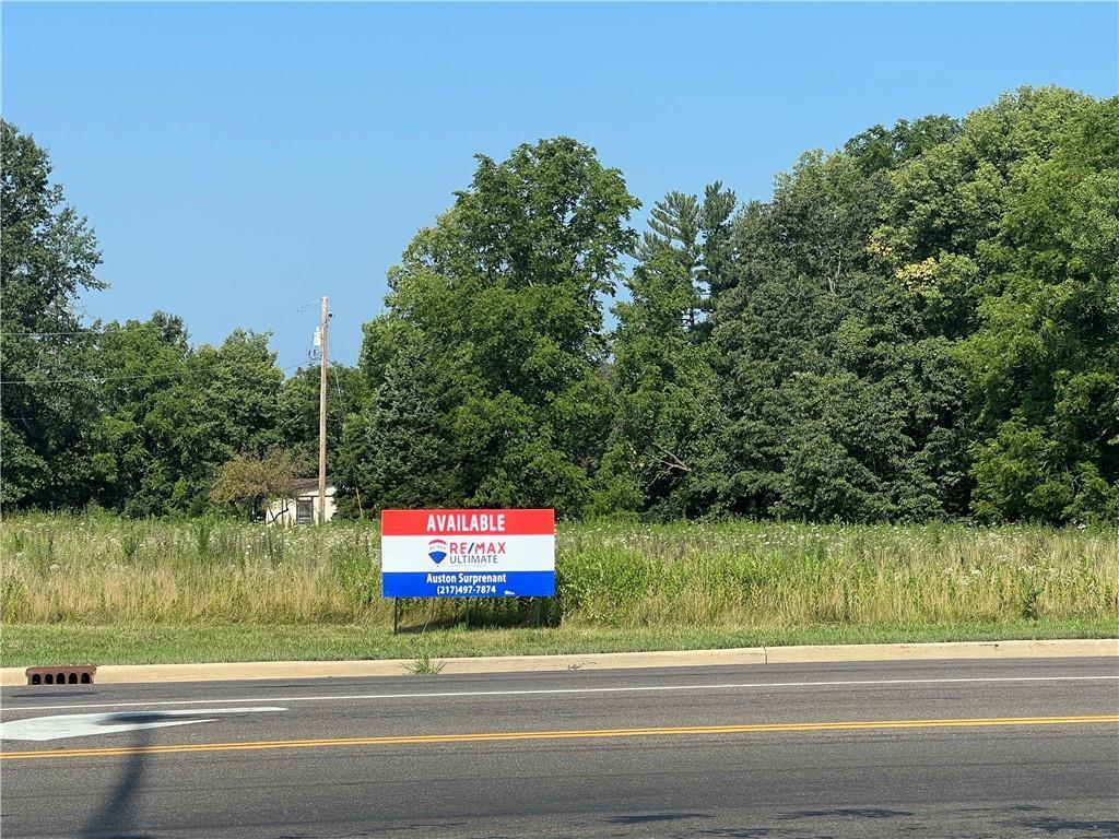 a sign board with street view