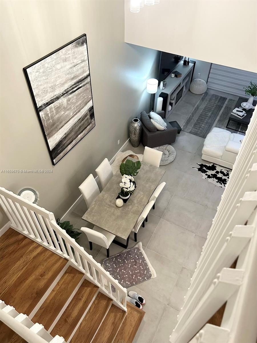 a view of living room with furniture and rug