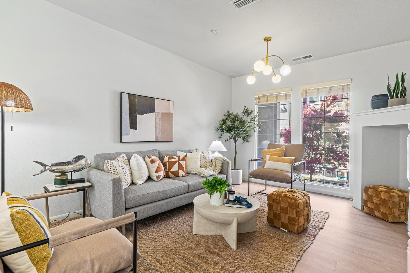 a living room with furniture and a chandelier