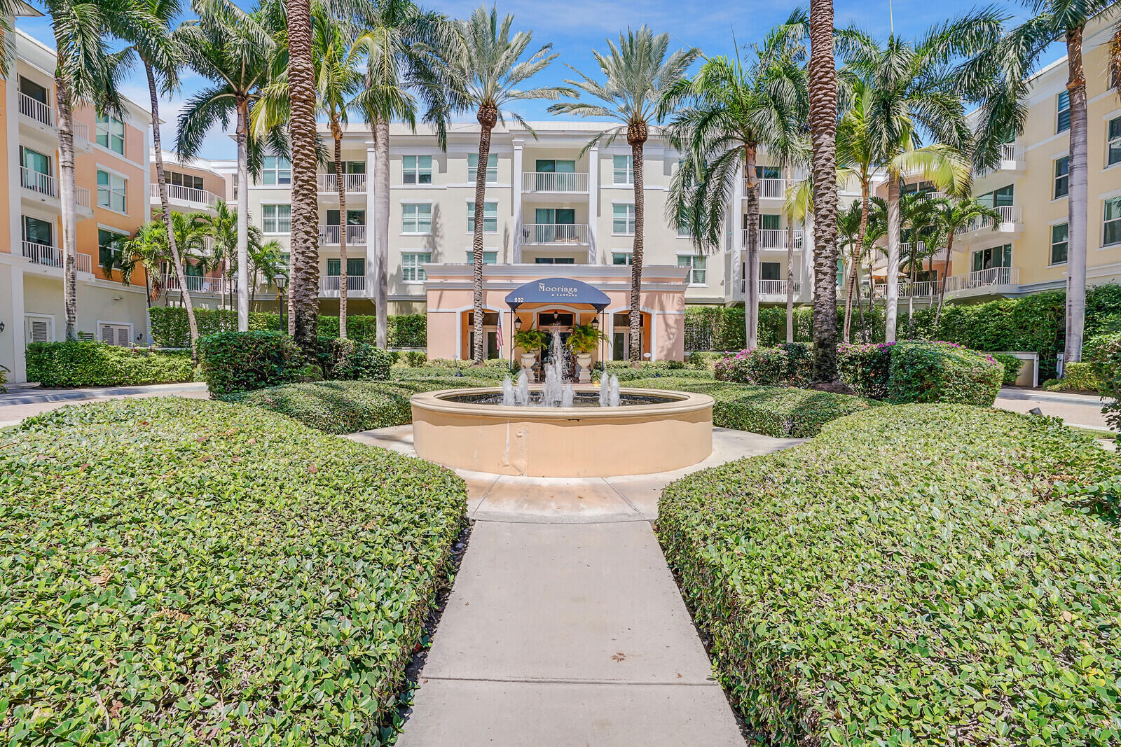 a building with palm trees in front of it