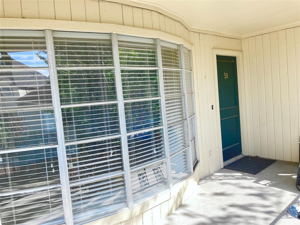 a view of a door and a wooden deck