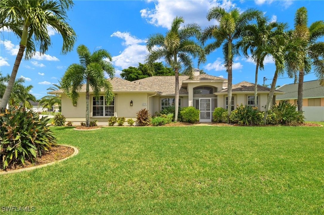 a front view of a house with a garden