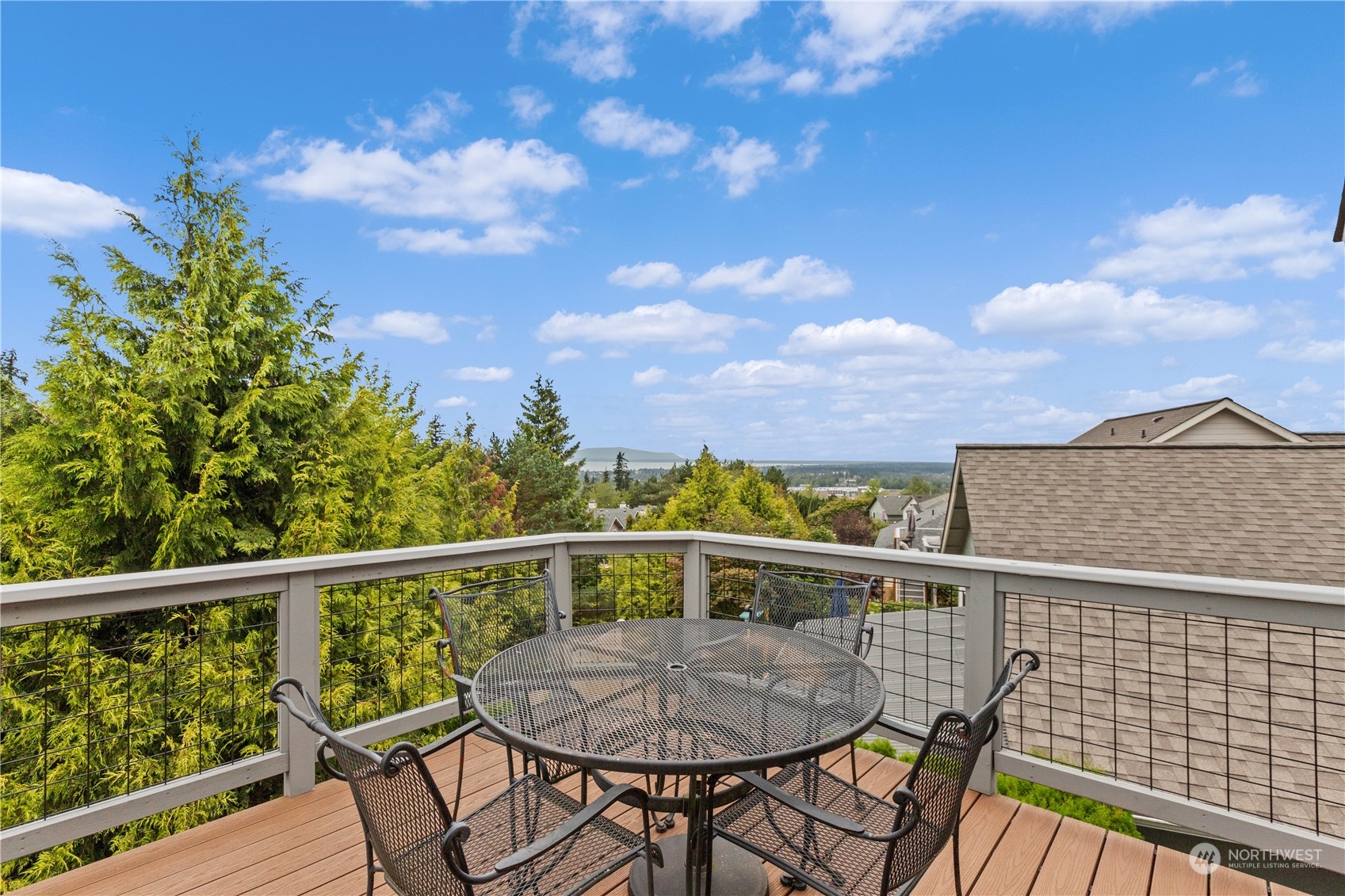 a view of a chairs and table on the deck