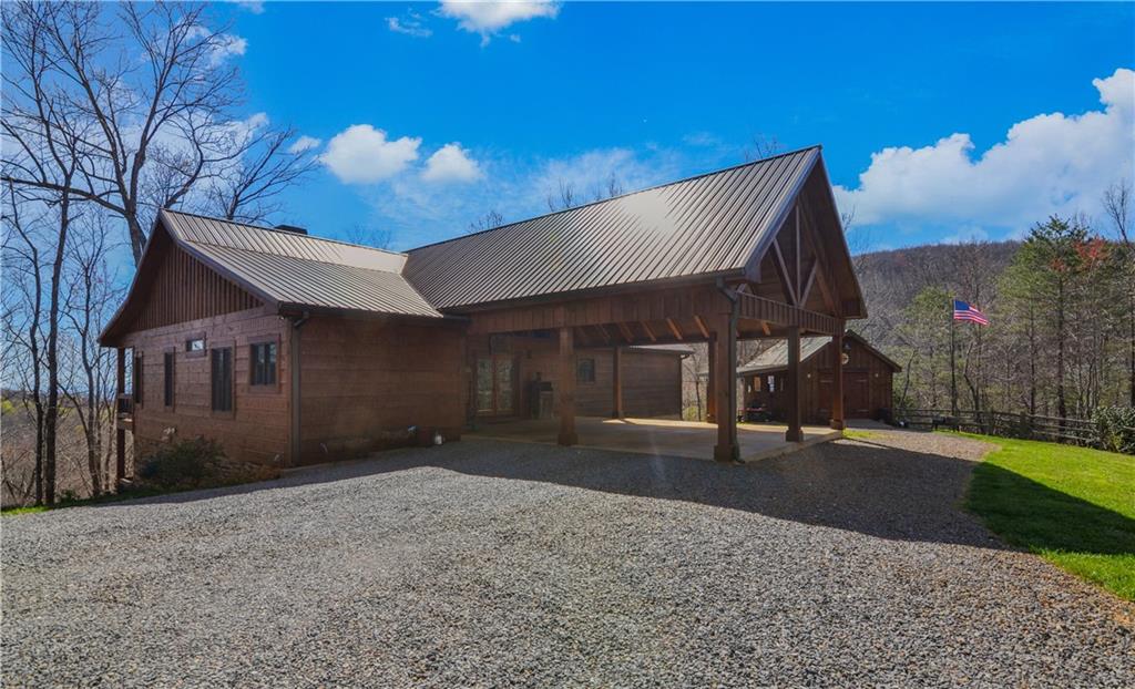 a view of a house with a yard and garage