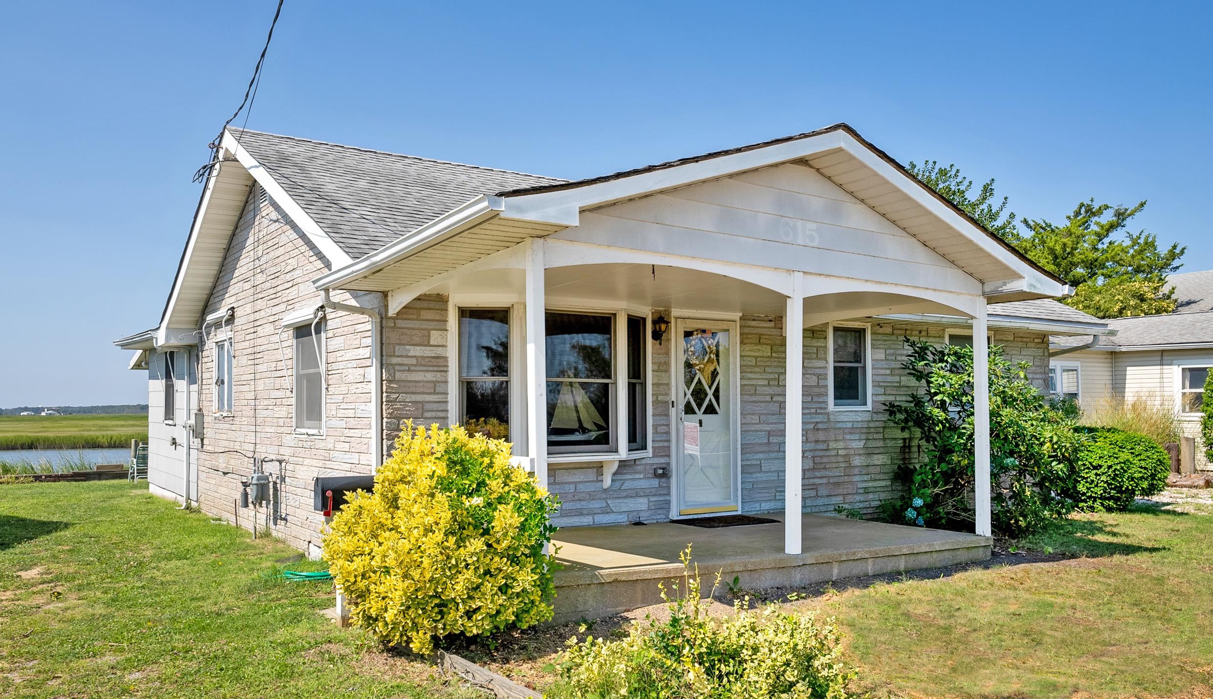 front view of a house with a yard