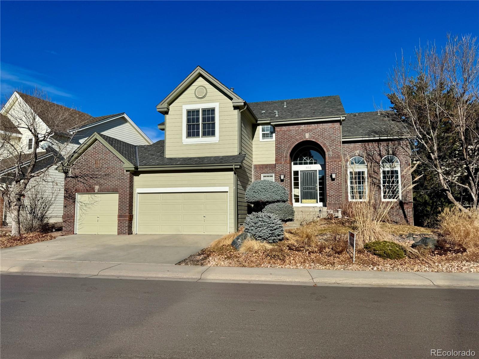 a front view of a house with a yard