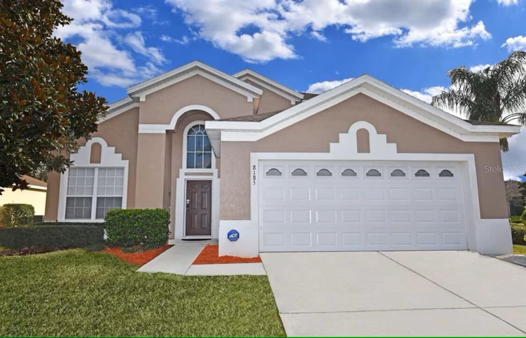 a front view of a house with yard