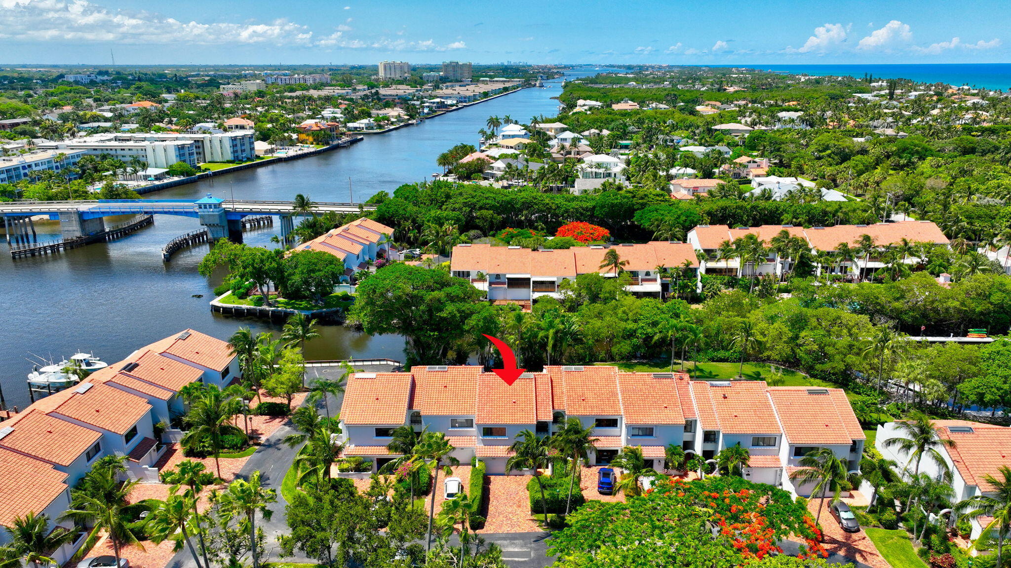 an aerial view of residential houses with outdoor space and swimming pool