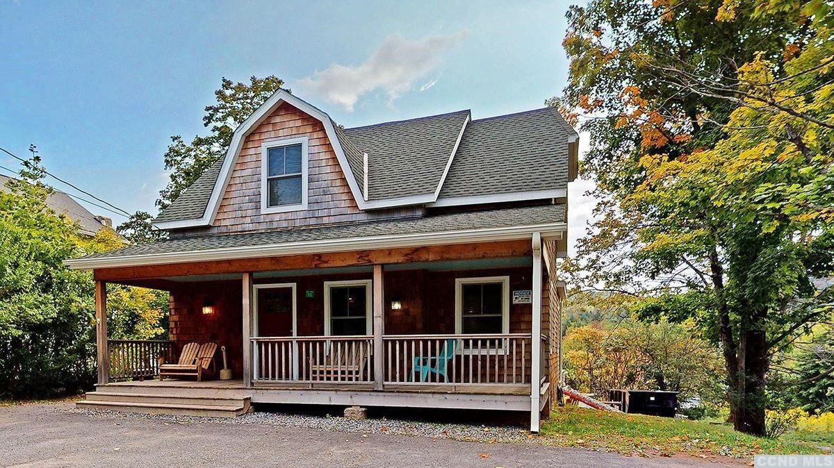 front view of a house with a yard