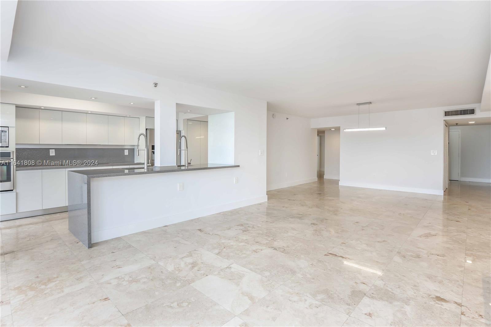 a view of a kitchen with a sink