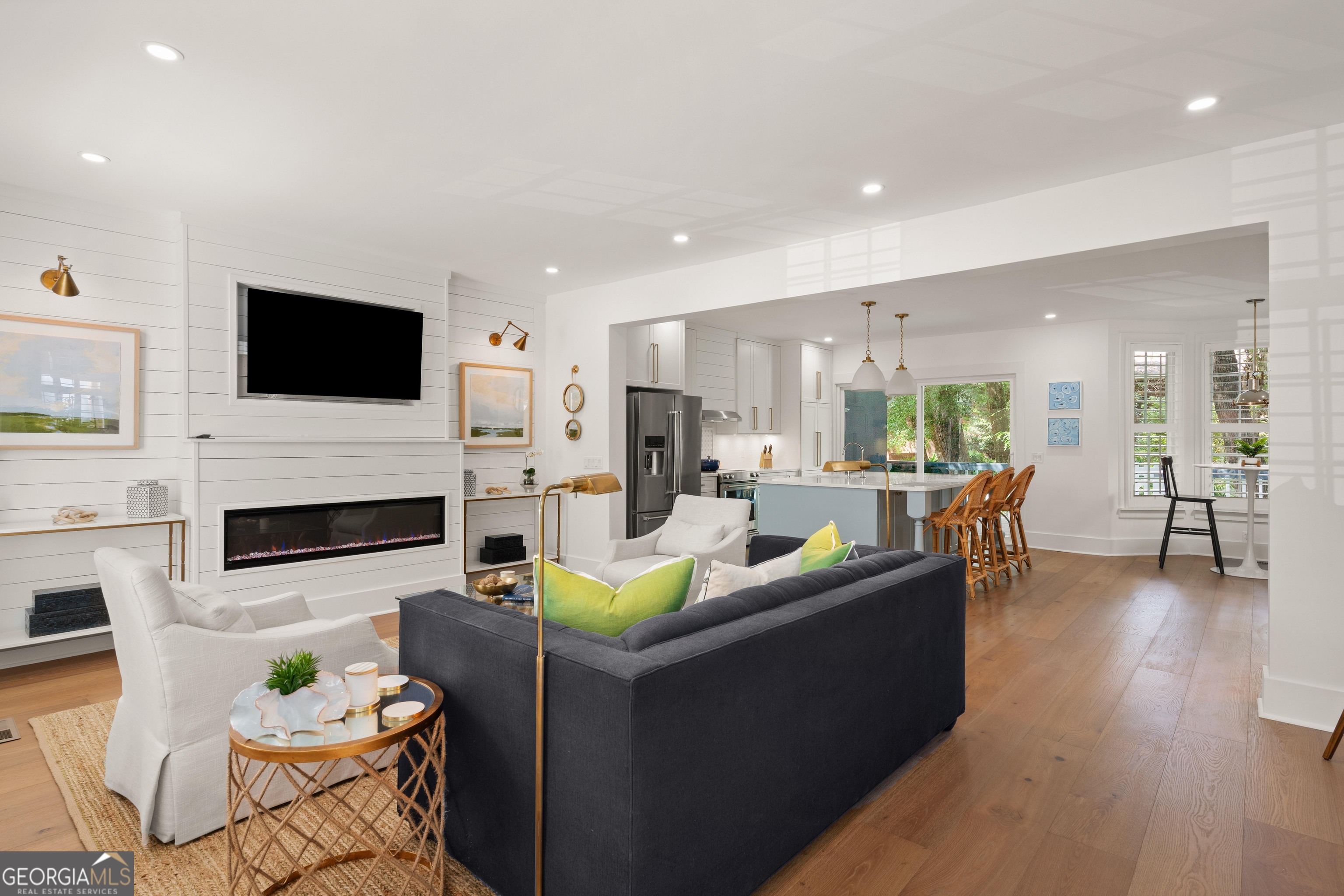 a living room with fireplace furniture and a flat screen tv