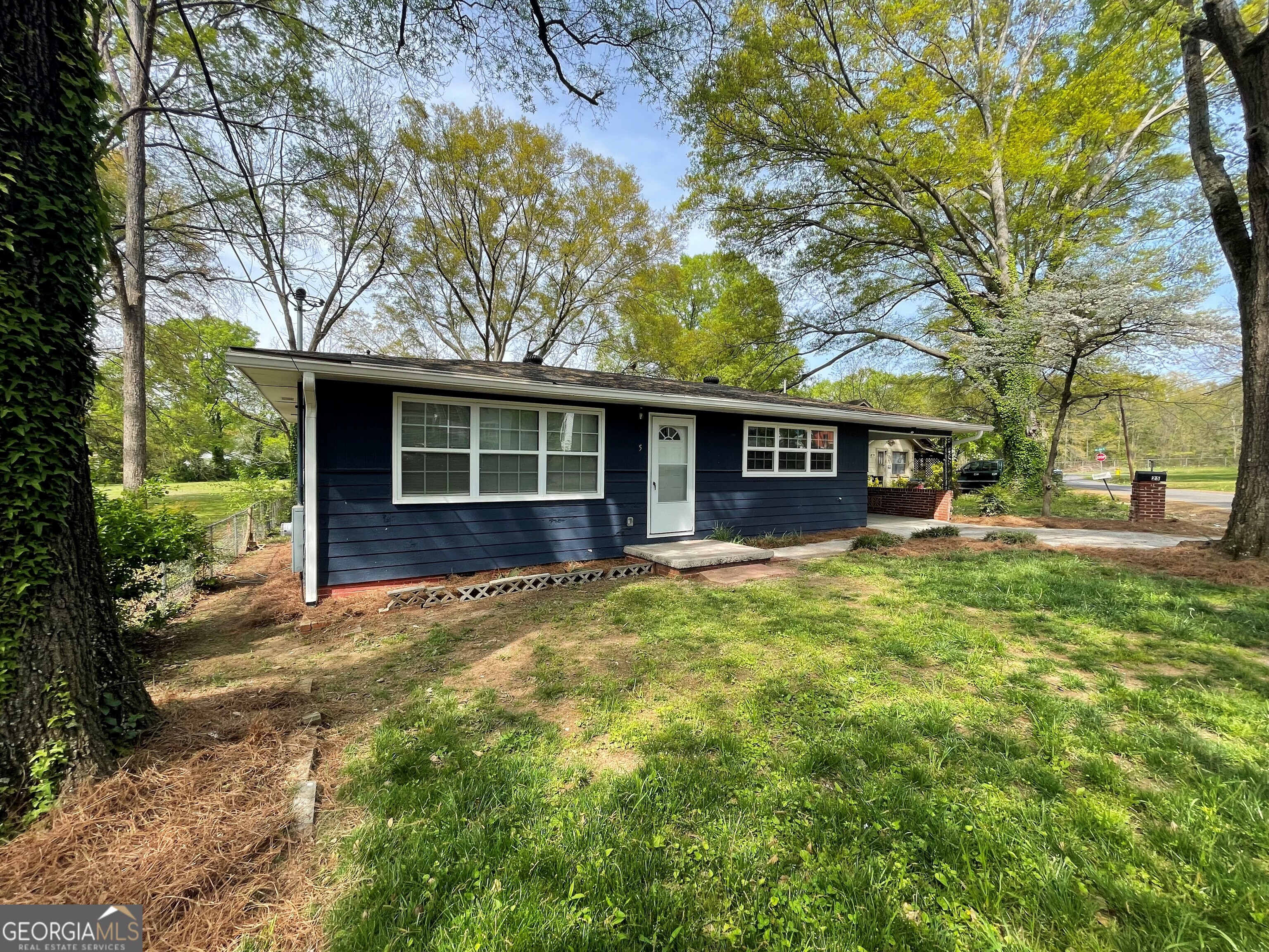 front view of a house with a yard