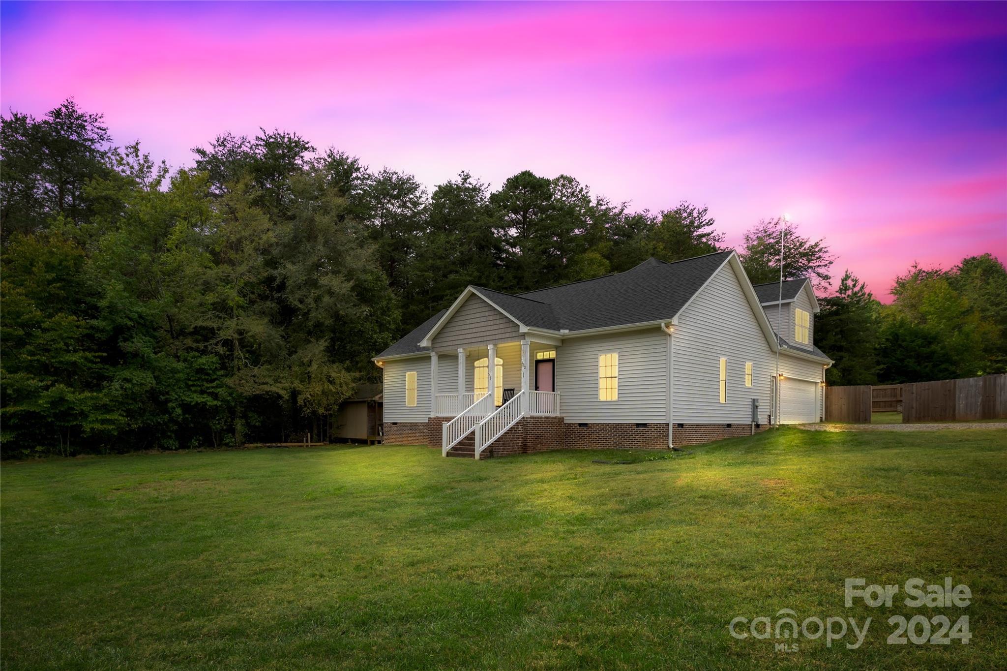 a view of a house with a big yard