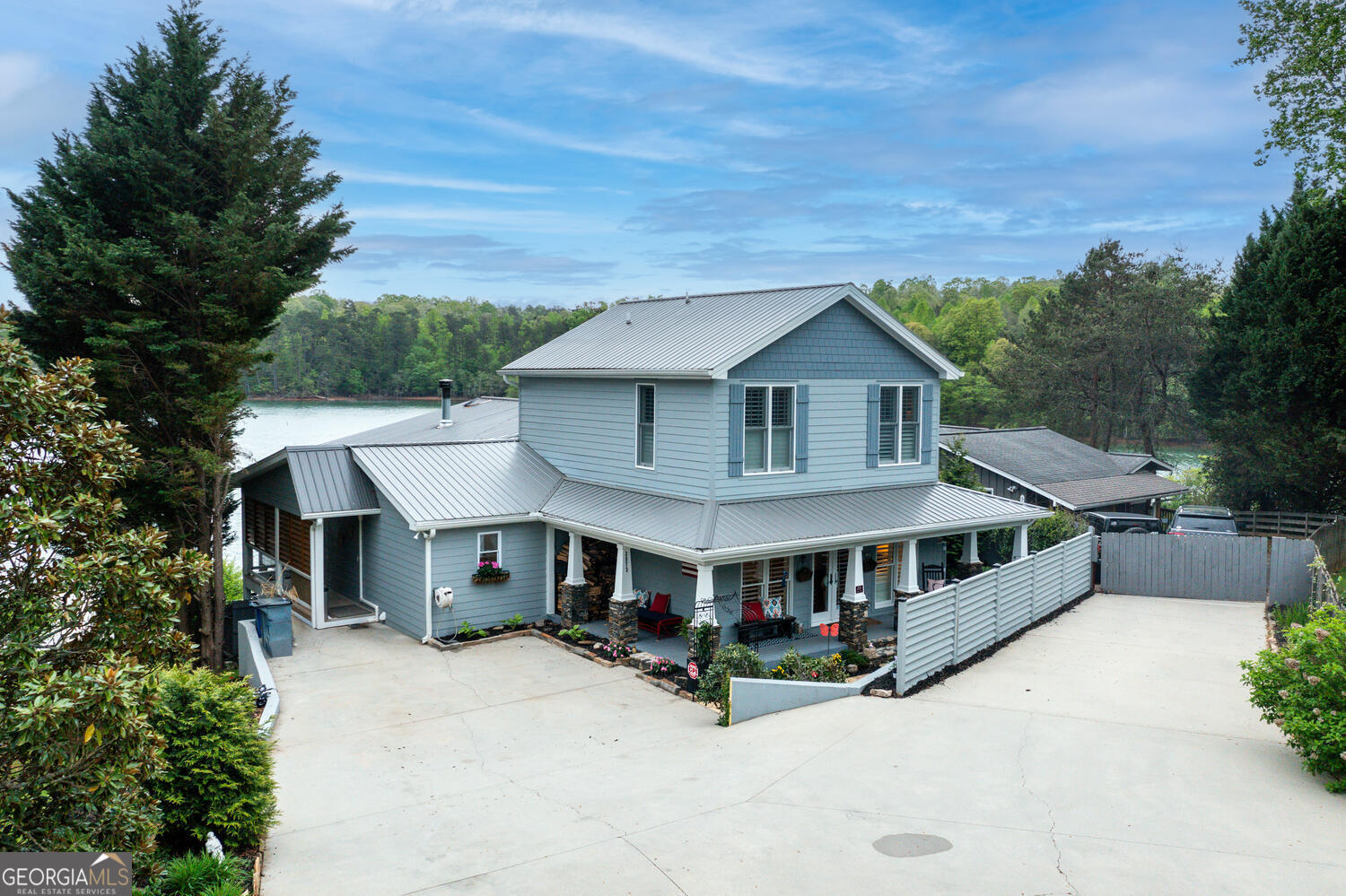 an aerial view of a house with roof deck front of house