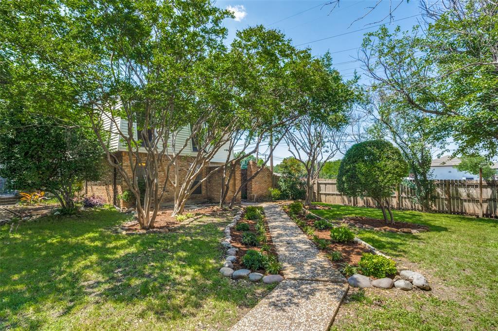 a view of backyard with green space