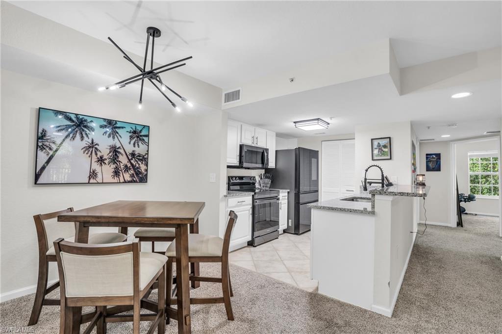 a view of kitchen with furniture and wooden floor