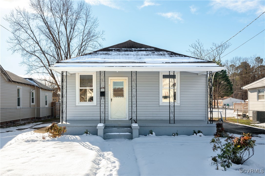 Bungalow featuring covered porch