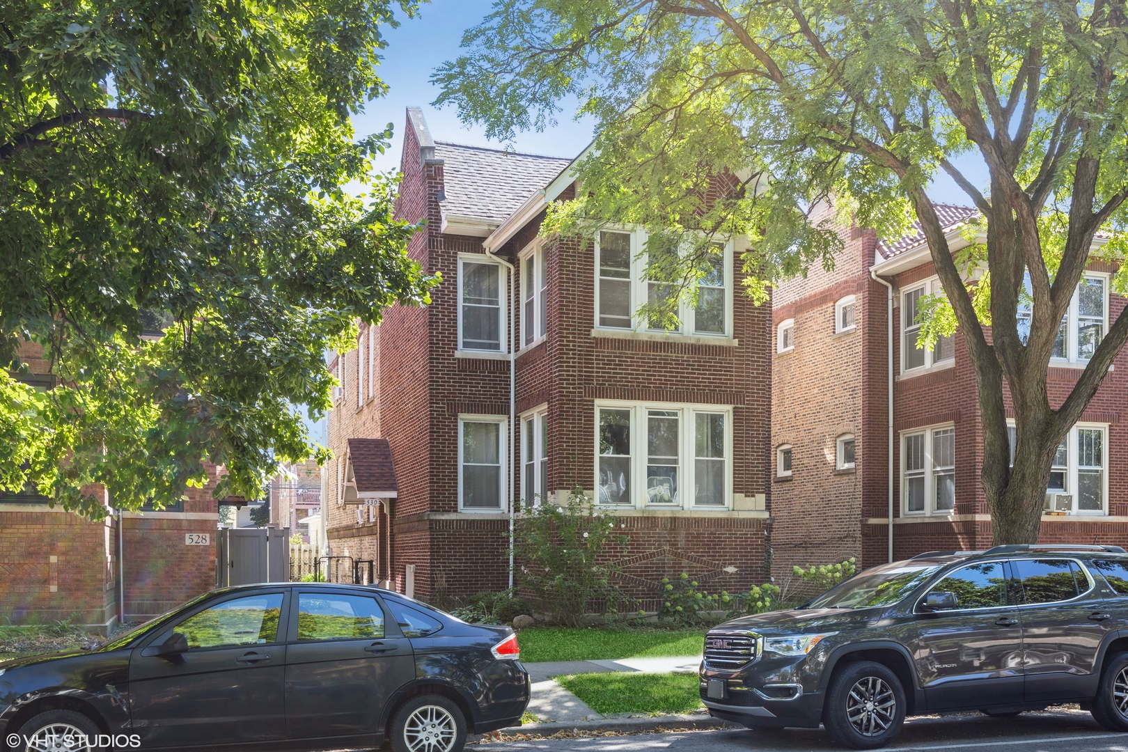 a front view of a house with parking space