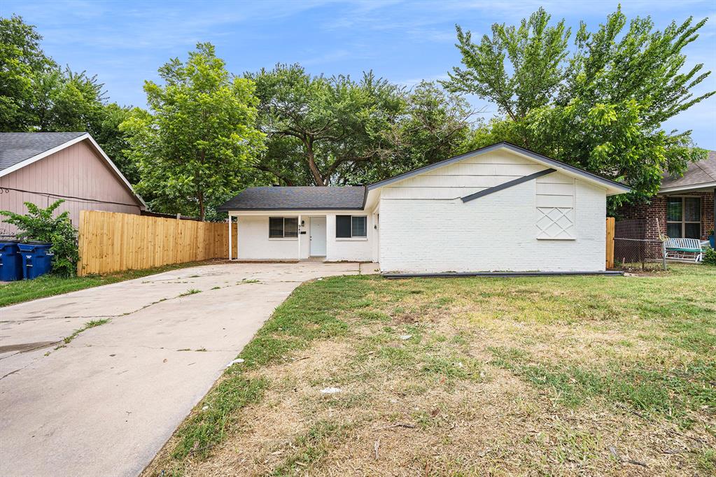 front view of a house with a yard