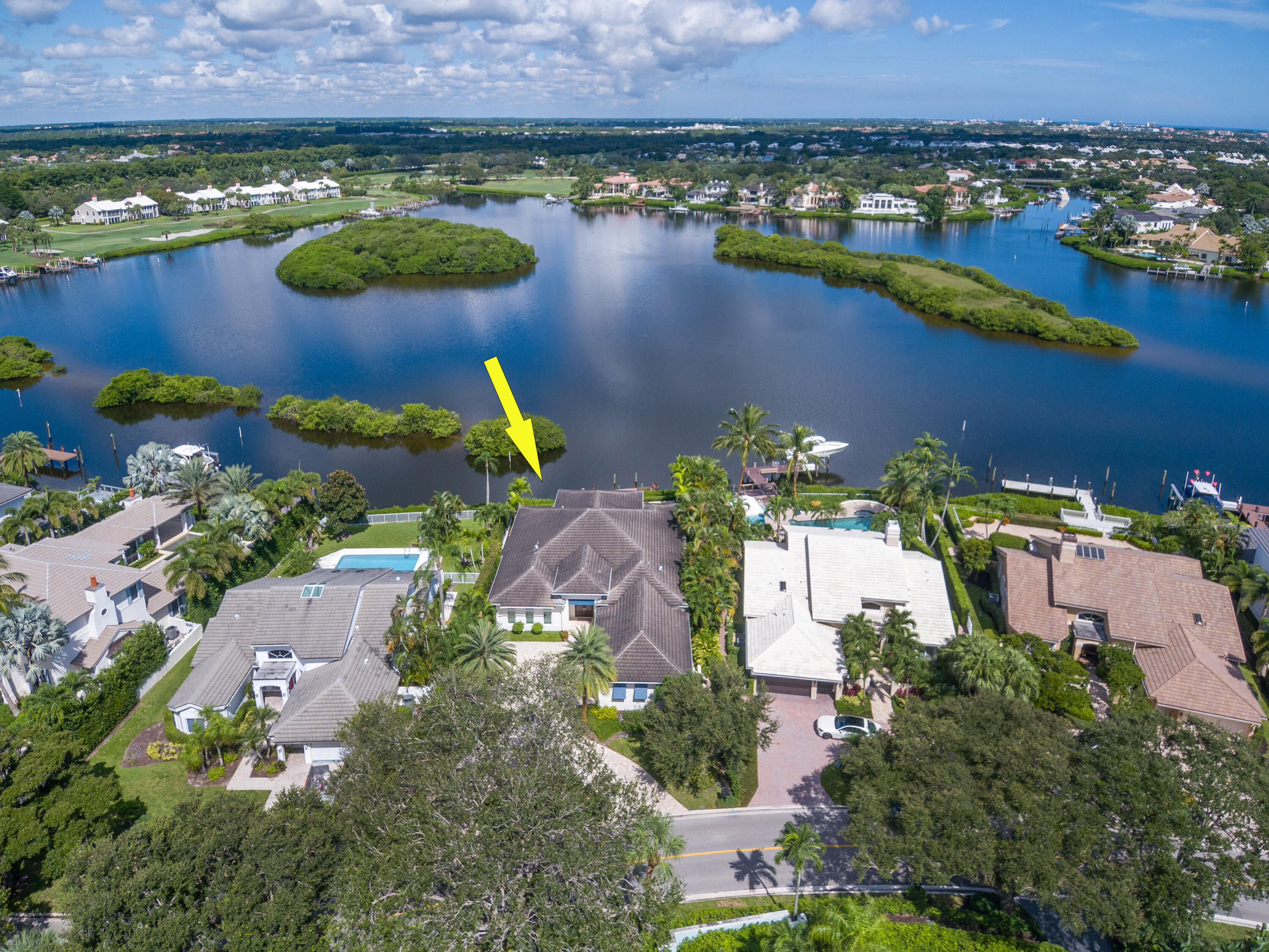 an aerial view of a house with a lake view