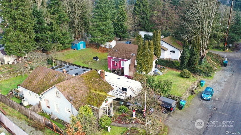 an aerial view of a house with a yard and garden